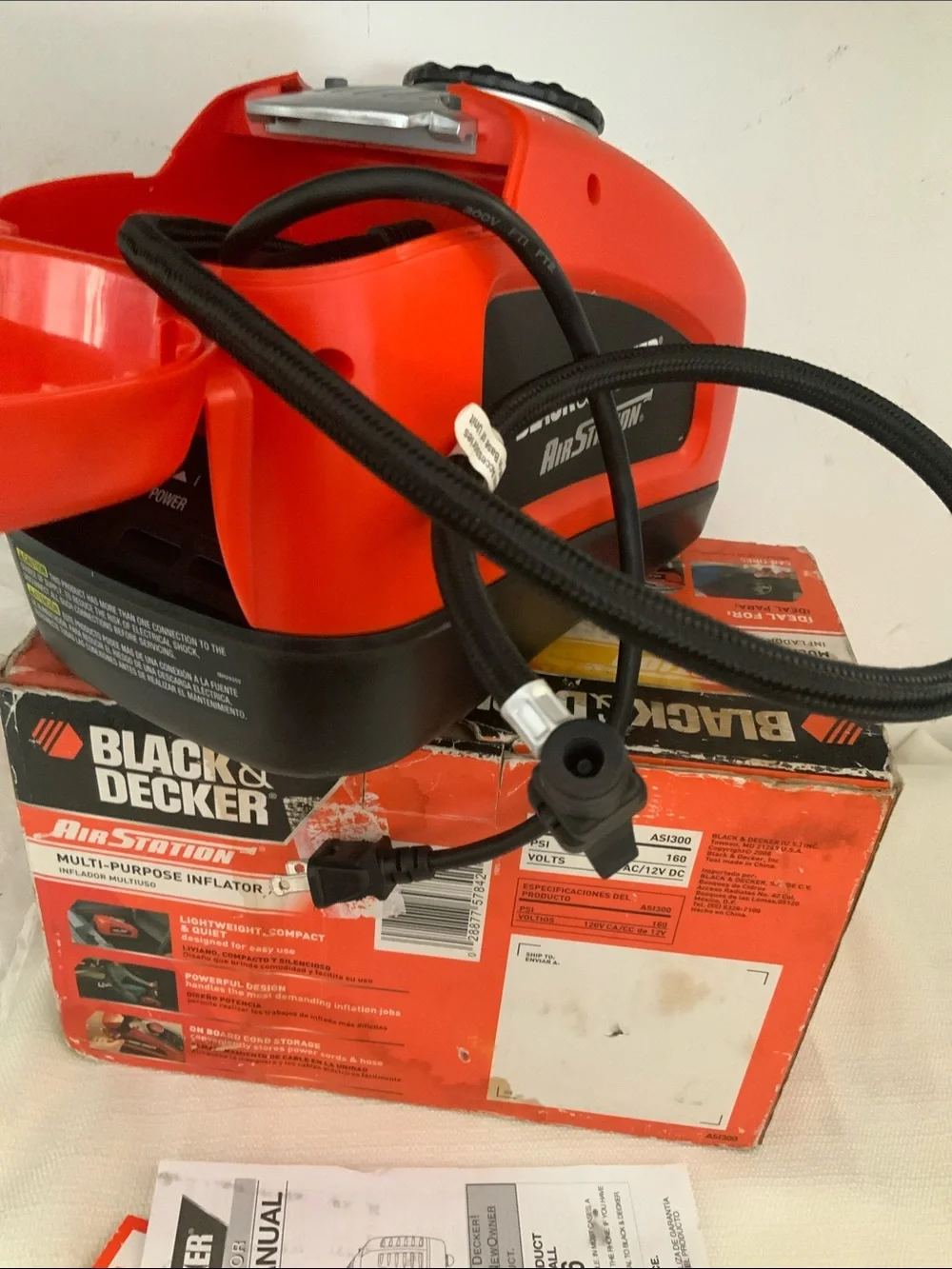 Black & Decker tire inflator. Manual included.